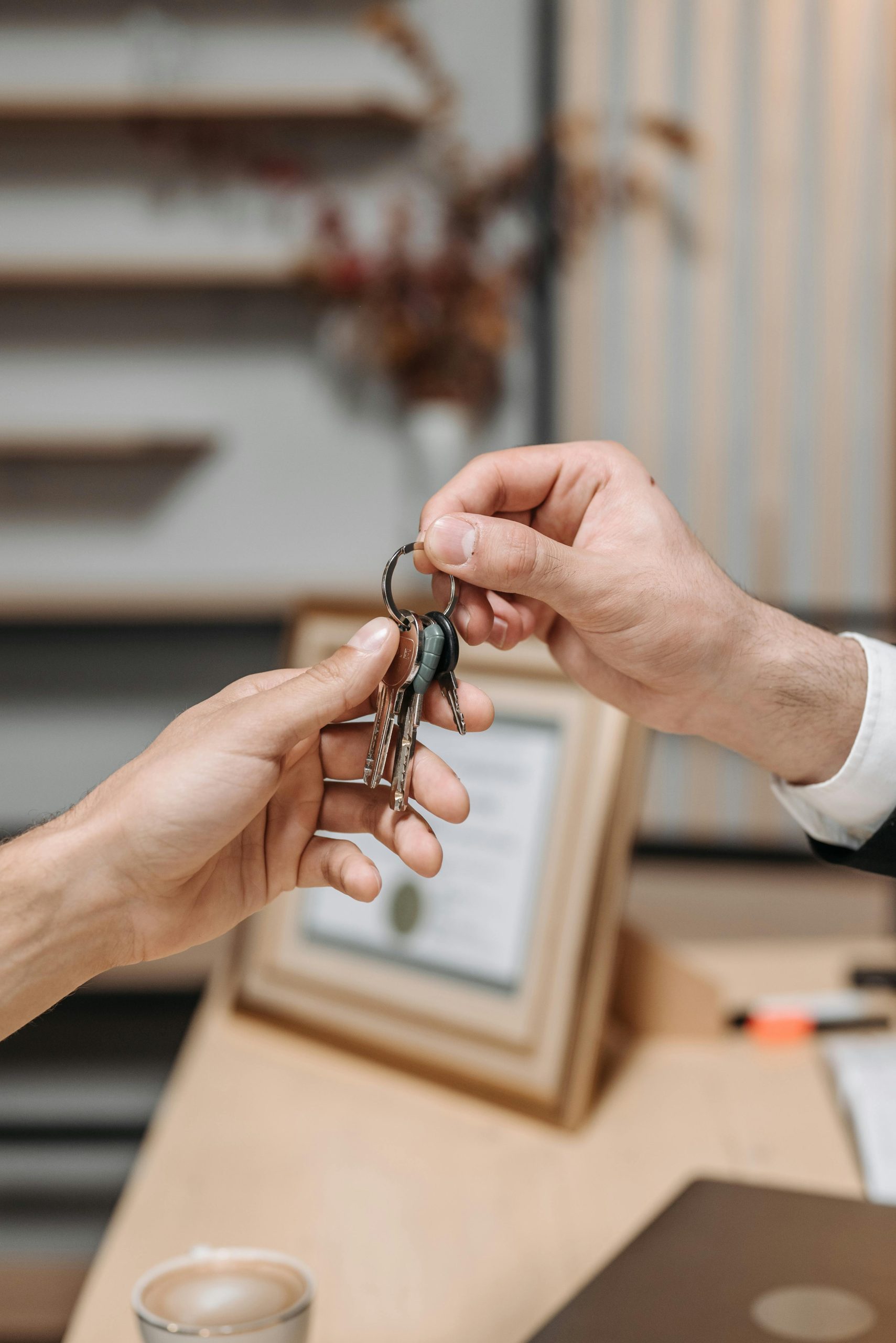 Realtor agent handing keys to new homeowners